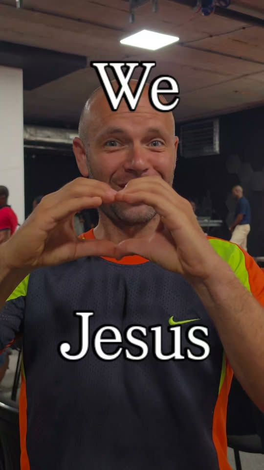 A member of Unfailing Love Church sharing a heart gesture